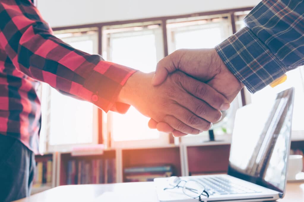 Two People Shaking Hands