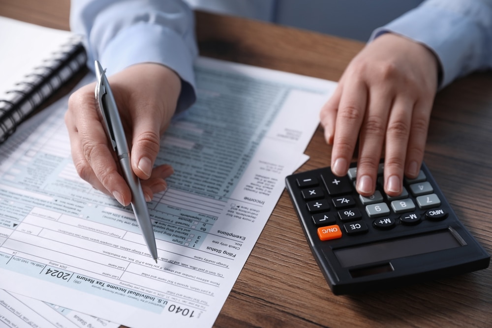 Person doing taxes at desk